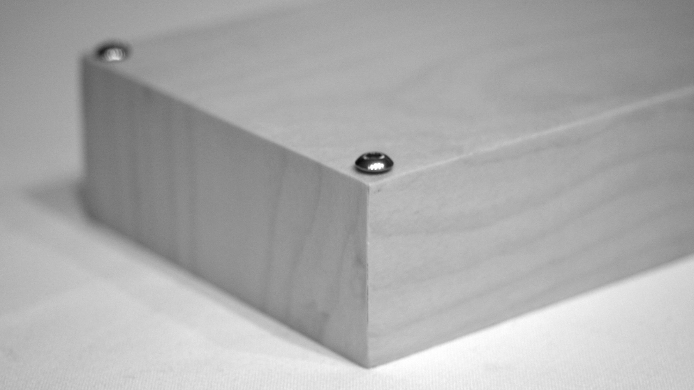 Detail of Bombo's wooden corner with visible screw
