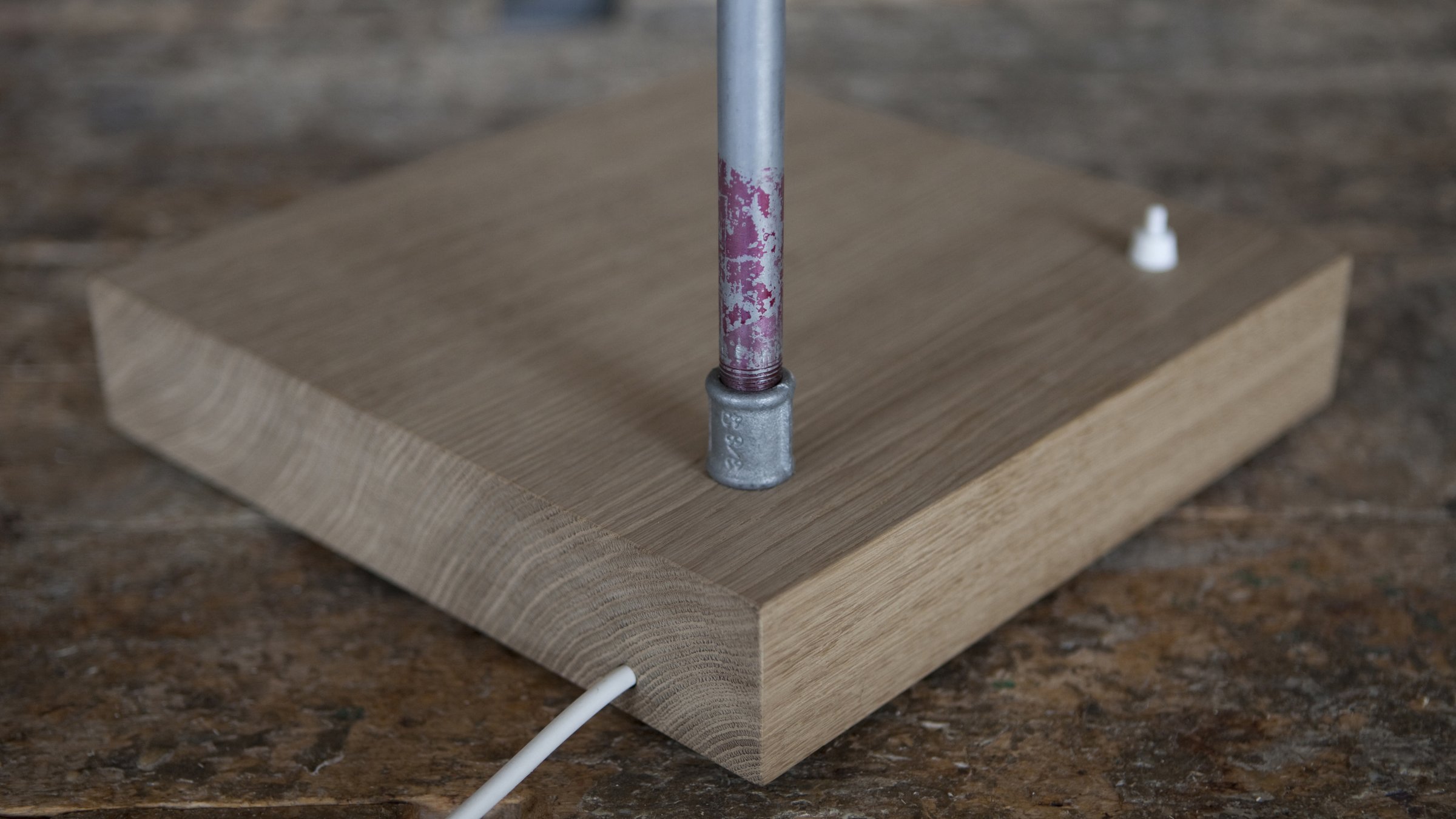 Detail of the wooden base of Tubularbells Orientabile